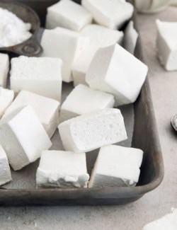 Homemade marshmallows piled into sheet pan