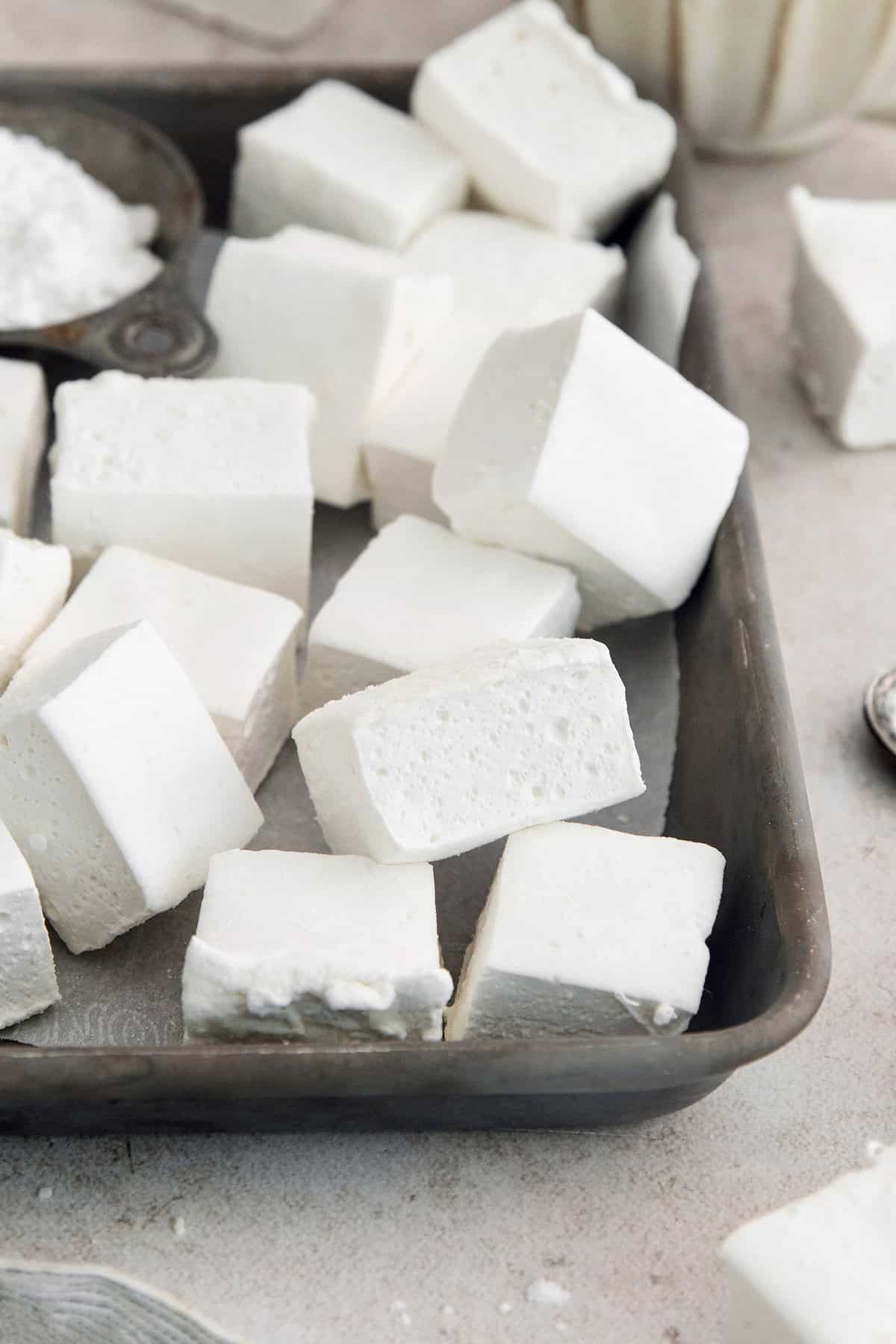 Homemade marshmallows piled into sheet pan