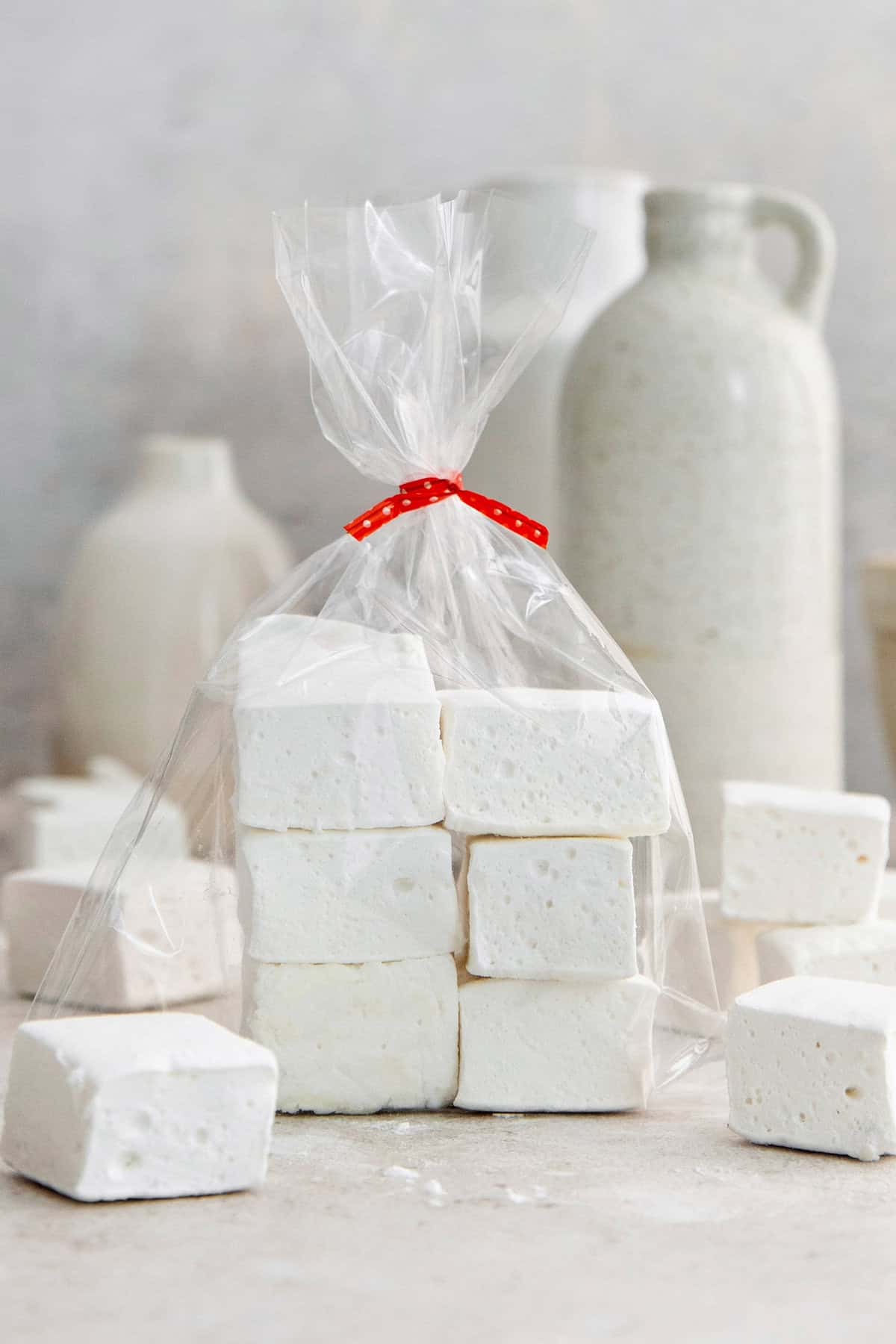 Homemade marshmallows in bag tied with red ribbon