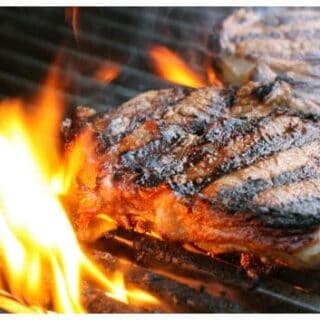 two steaks on a grill