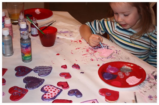 a girl painting ornaments