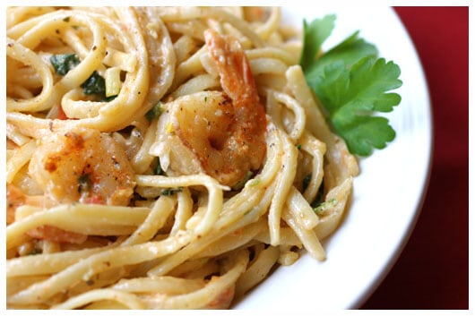 Plate of shrimp pasta in a cream sauce.