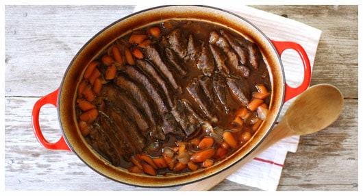 This pot roast is a classic family favorite and filled with tender slow-cooked beef, onions, and carrots.