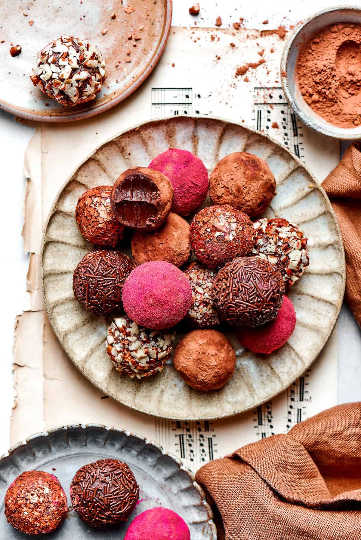 Melt-in-your-mouth Chocolate Truffles are an indulgence worth making from scratch. This easy recipe calls for only 6 simple ingredients! Overhead view of chocolate truffles on plate