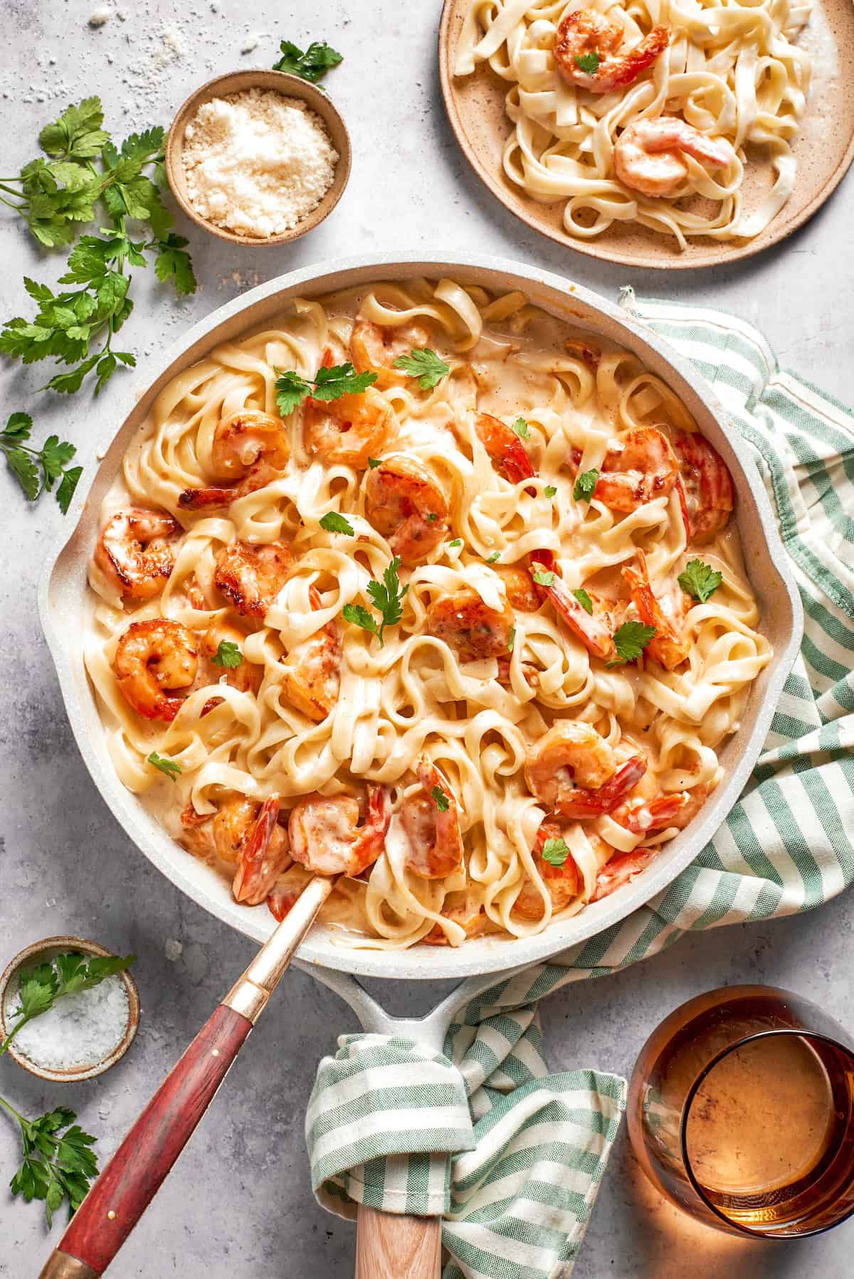 Skillet with creamy shrimp pasta.
