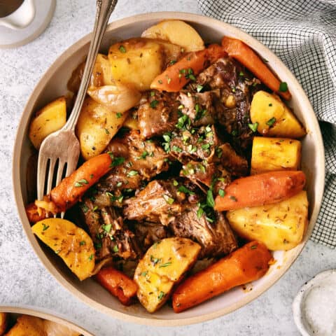 Overhead view of pot roast in a bowl