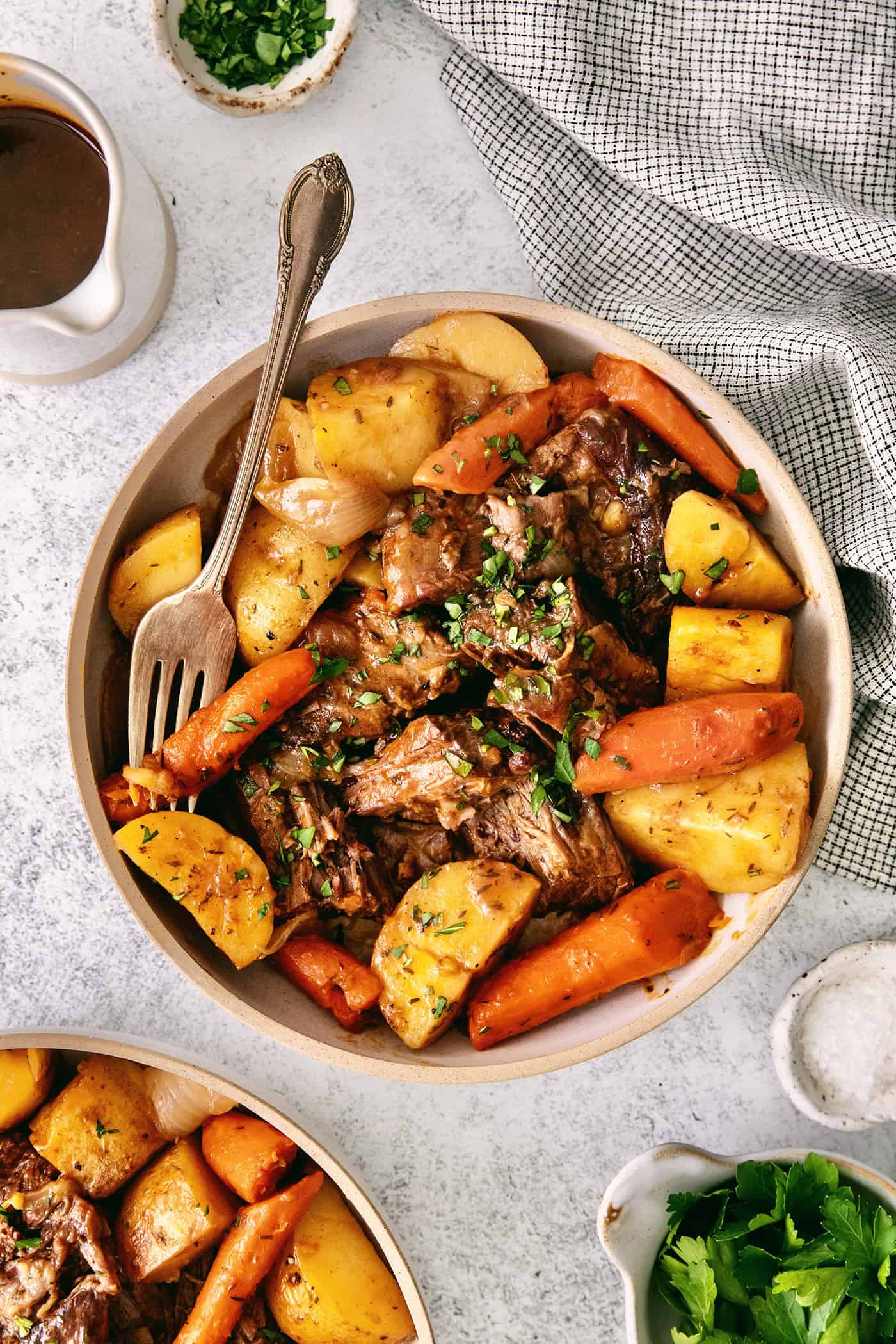 Overhead view of a bowl of beef pot roast with vegetables