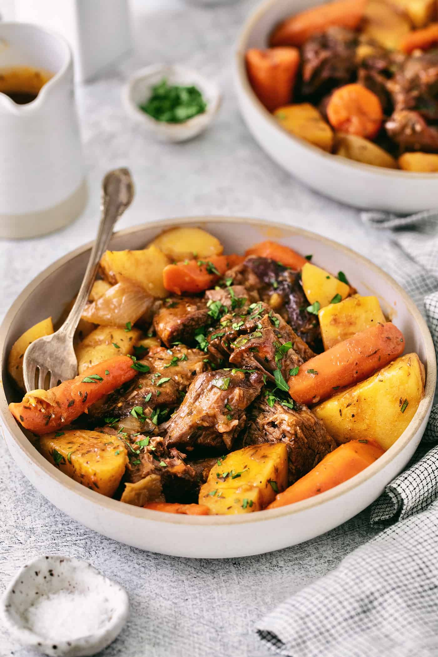 Beef pot roast with potatoes and carrots in a bowl