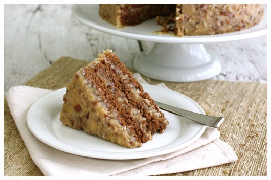 A slice of German Chocolate Cake on a white plate