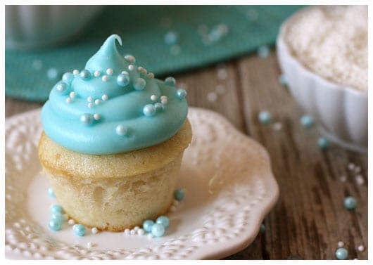 a mini cupcake with blue frosting