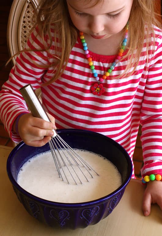 a girl Whisking Lemon Buttermilk Sherbet