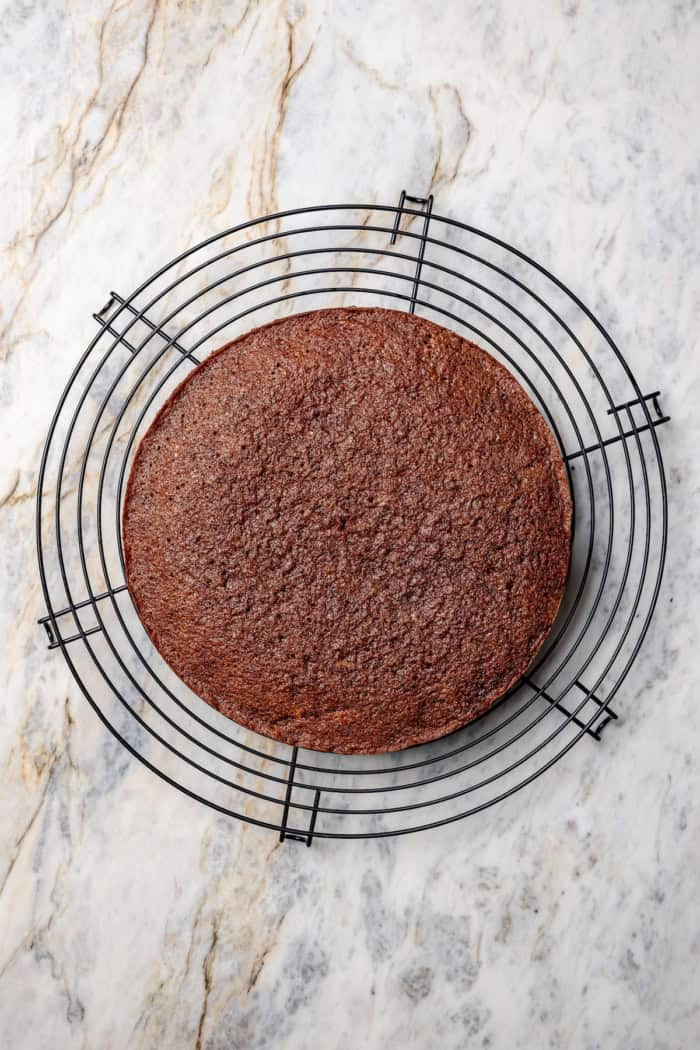 Overhead view of German chocolate cake round cooling on rack