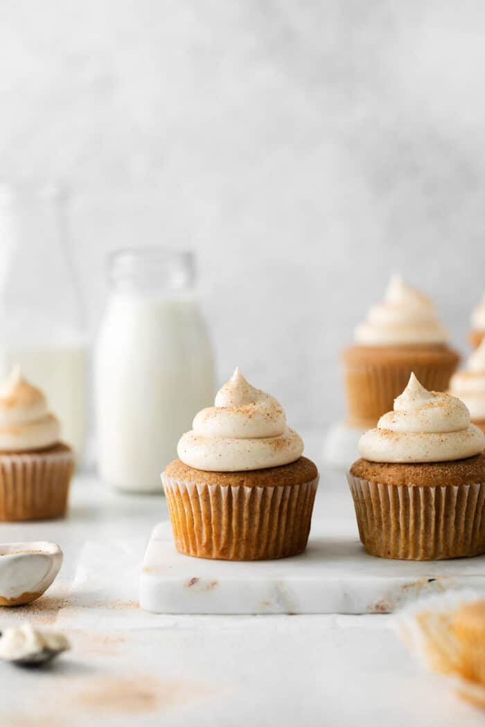 3 cinnamon cupcakes with cream cheese frosting
