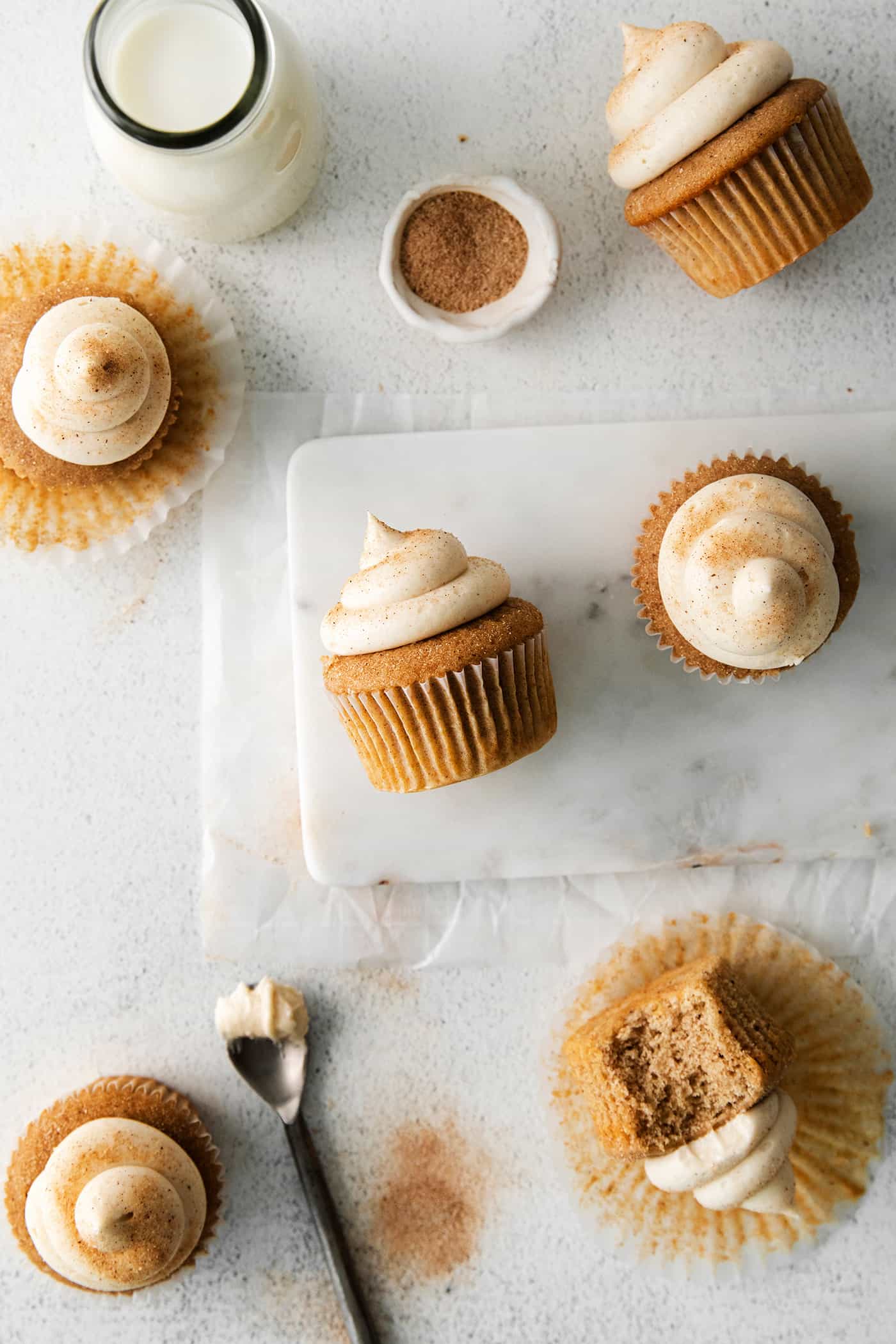 Overhead view of snickerdoodle cupcakes with cream cheese frosting