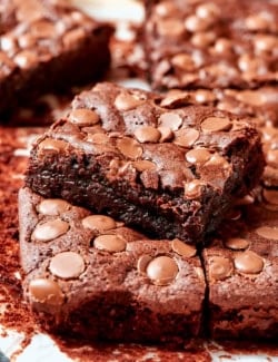 Fudgy brownie stacked on top of other brownies