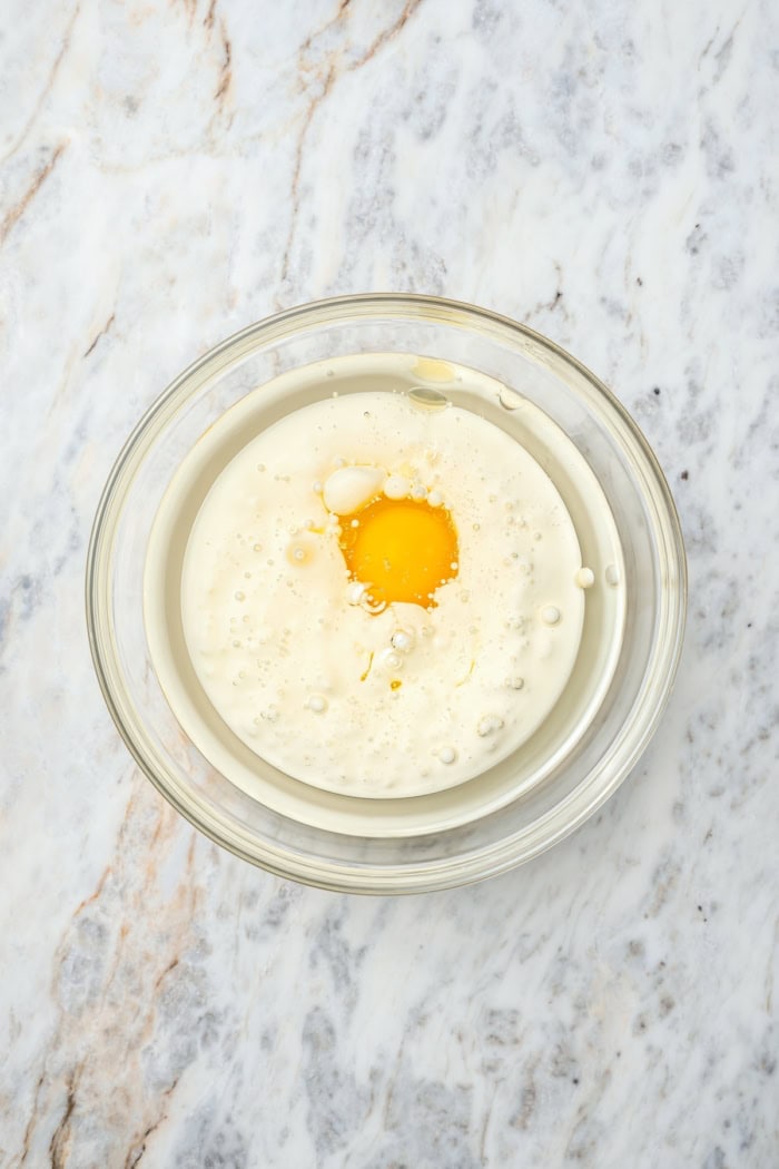 Wet ingredients for cake in bowl before whisking.