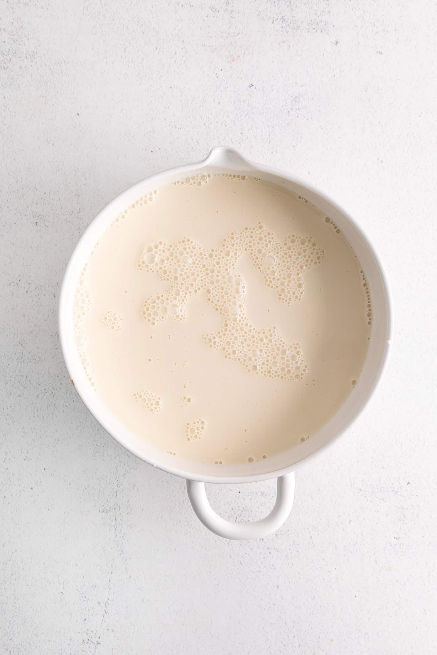 Tres leche cake glaze in a bowl