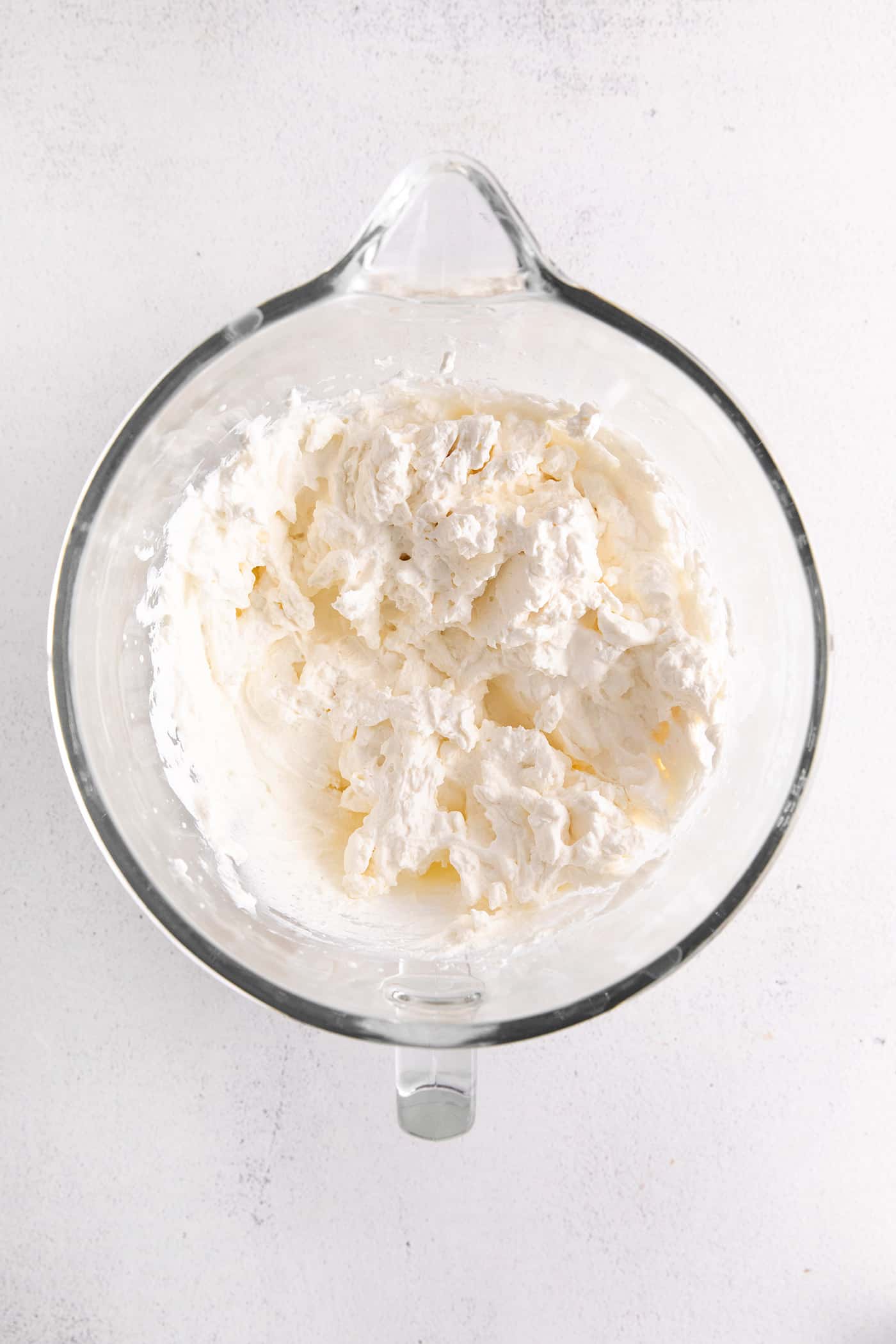 Whipped cream in a mixing bowl