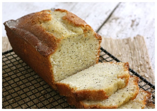 Sliced Orange Glazed Poppy Seed Bread on a wire rack