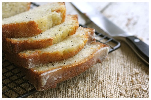 A close up shot of sliced Orange Glazed Poppy Seed Bread