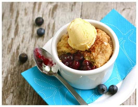 an individual blueberry pot pie with vanilla ice cream