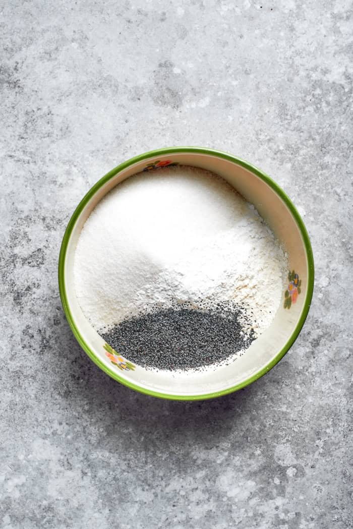 Dry ingredients and poppy seeds in mixing bowl.