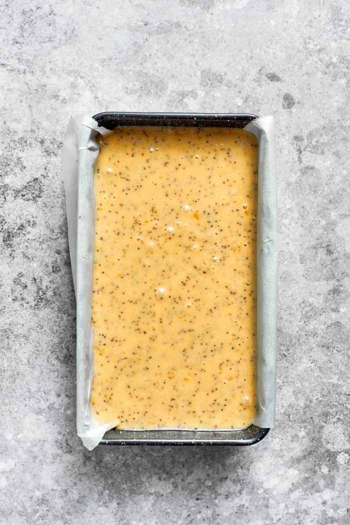 Orange poppy seed bread batter in pan.