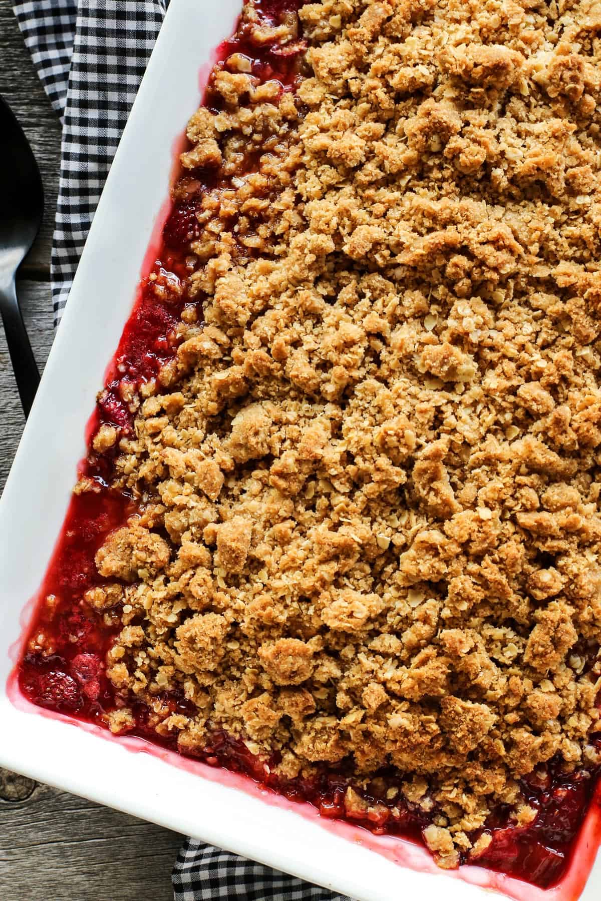 a large white rectangular pan of strawberry rhubarb crisp