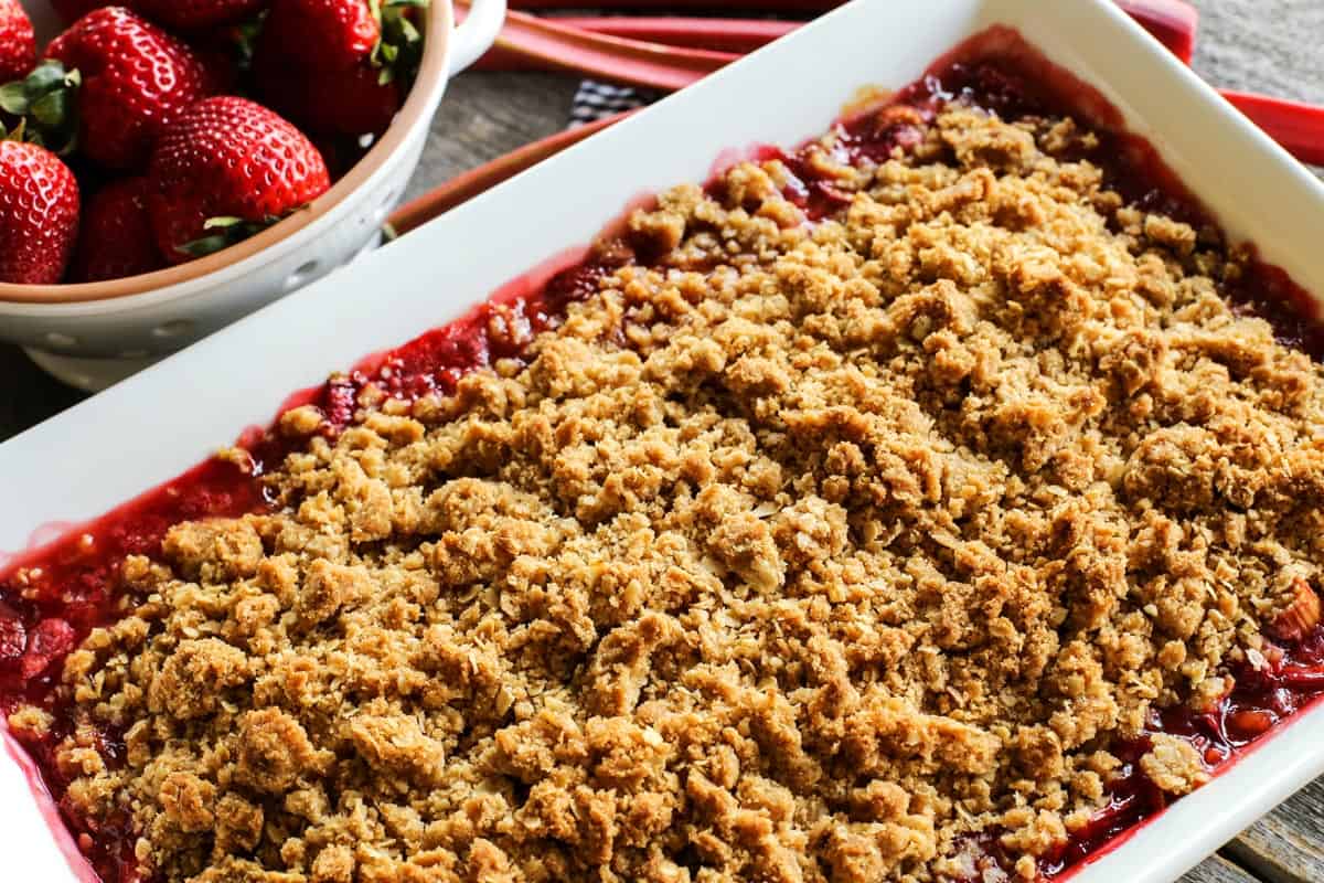 strawberry rhubarb crisp in a large white dish