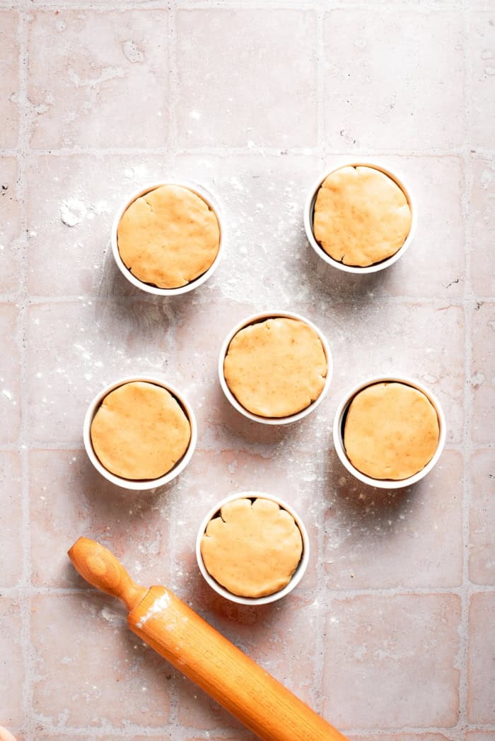 Cobbler topping added to ramekins.