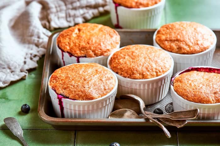 Mini blueberry cobblers on sheet pan.
