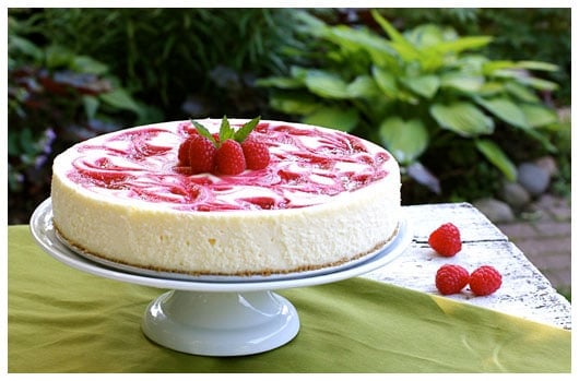 a whole raspberry swirl cheesecake