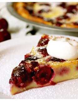 This slice of cherry clafouti with whipped cream is one of the best French dessert recipes ever.