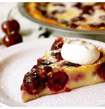 This slice of cherry clafouti with whipped cream is one of the best French dessert recipes ever.