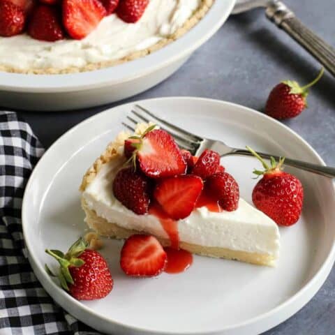 a slice of strawberry cream cheese pie on a white plate