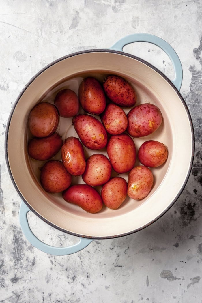 Overhead view of red potatoes in pot