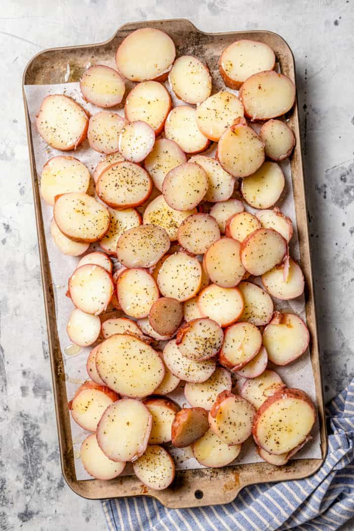 Overhead view of oiled and seasoned red potatoes