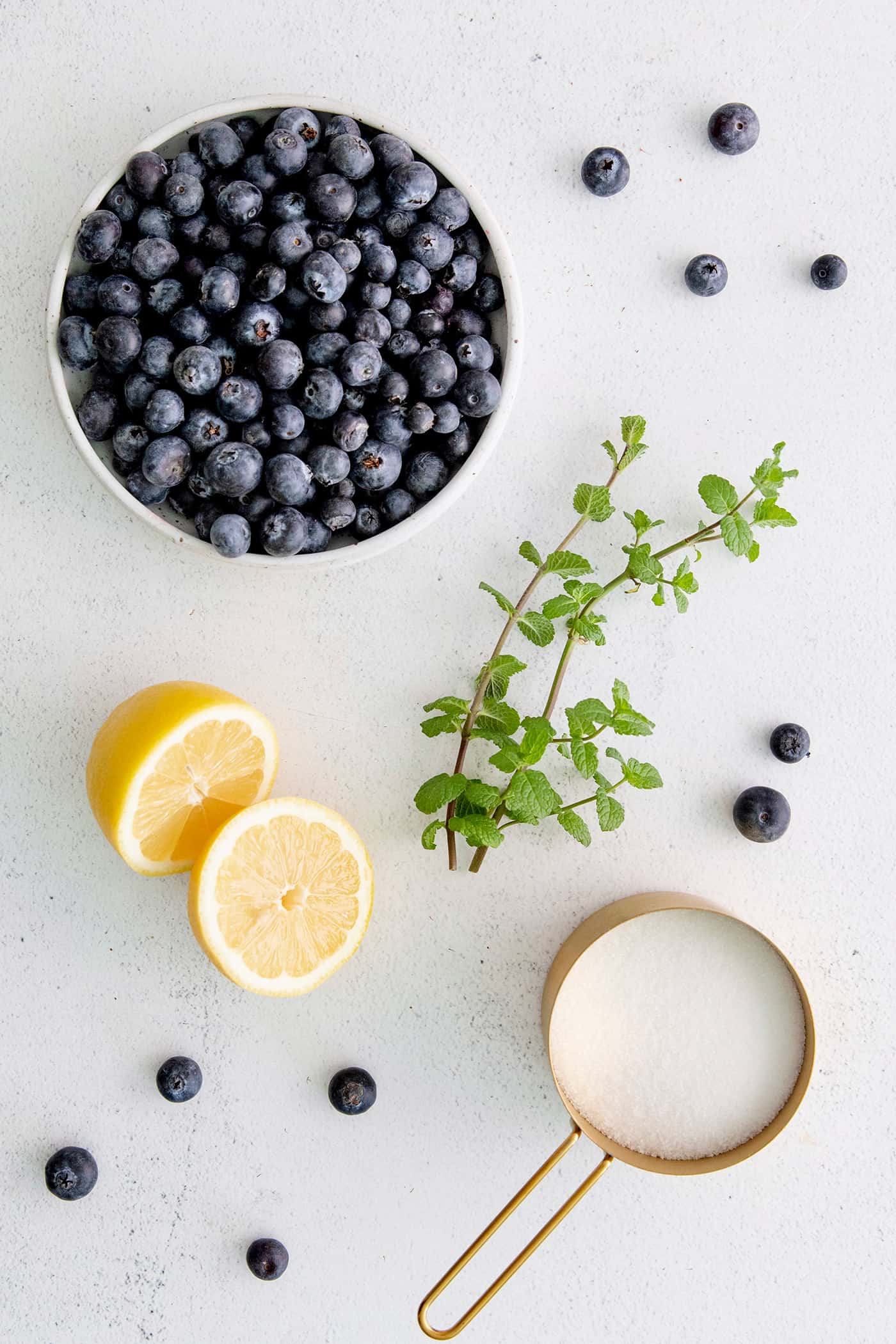 Overhead view of blueberry jam with mint ingredients