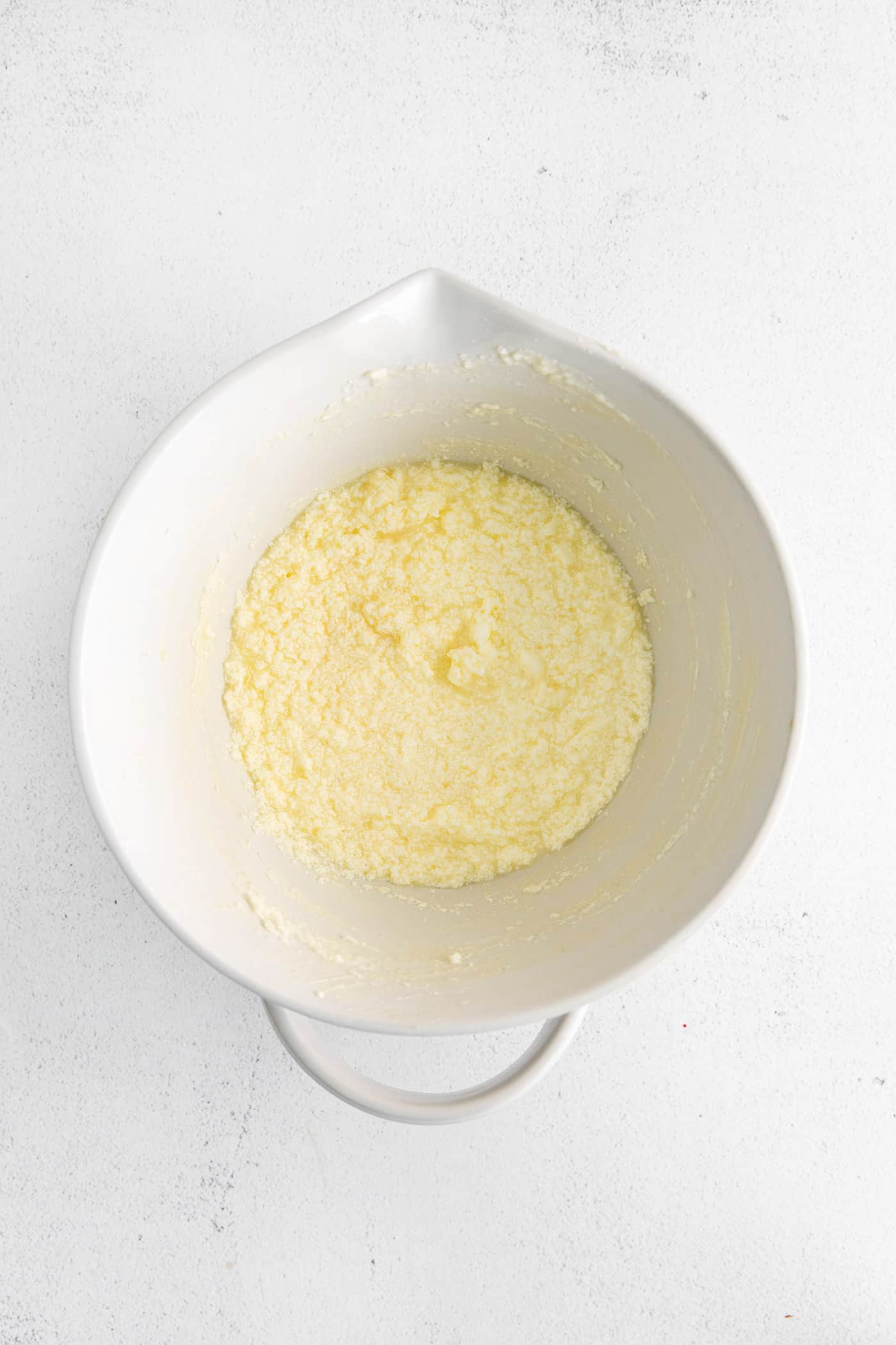 Whipped butter and sugar in a mixing bowl