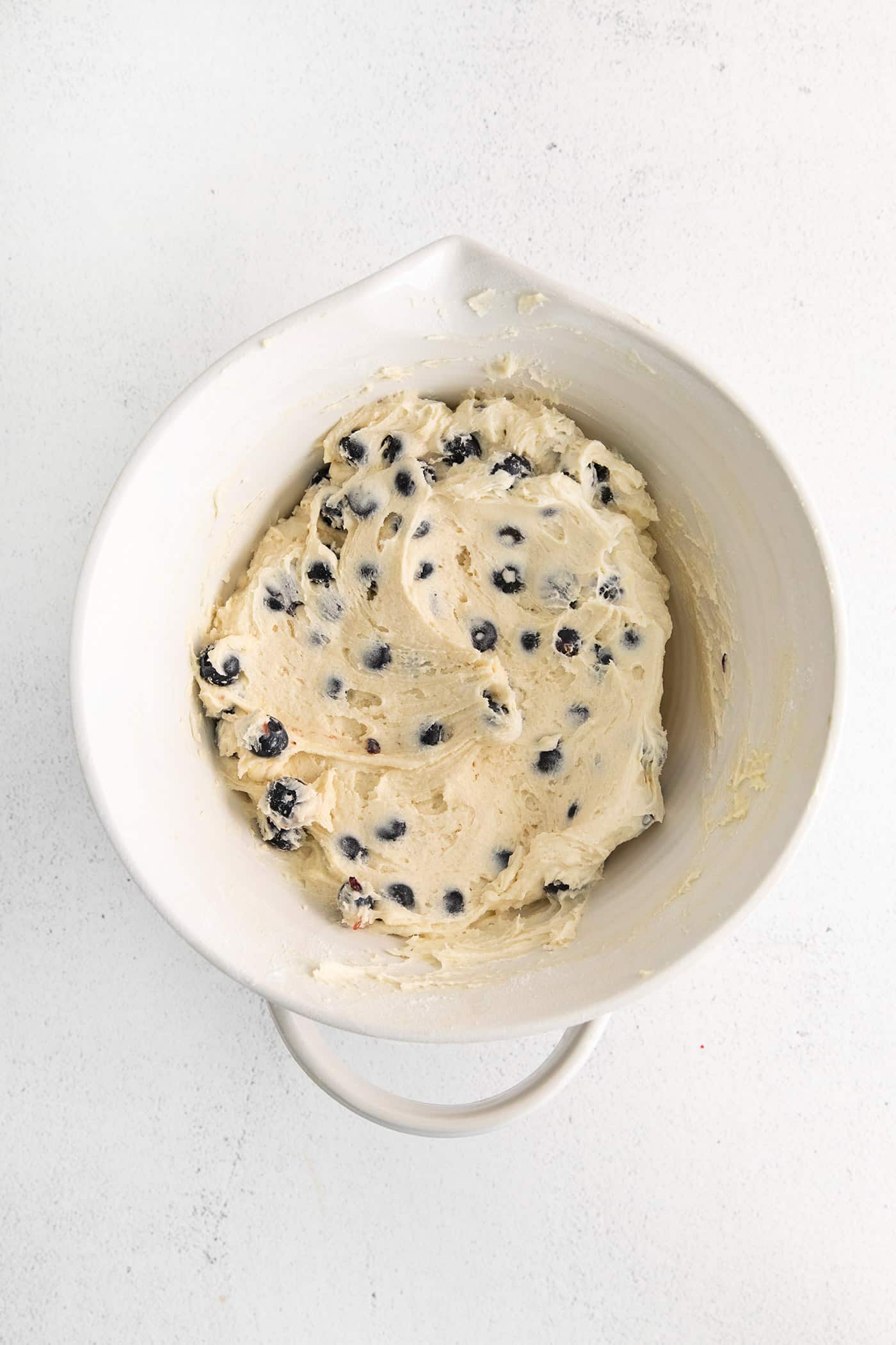 Blueberry tea cake batter in a mixing bowl