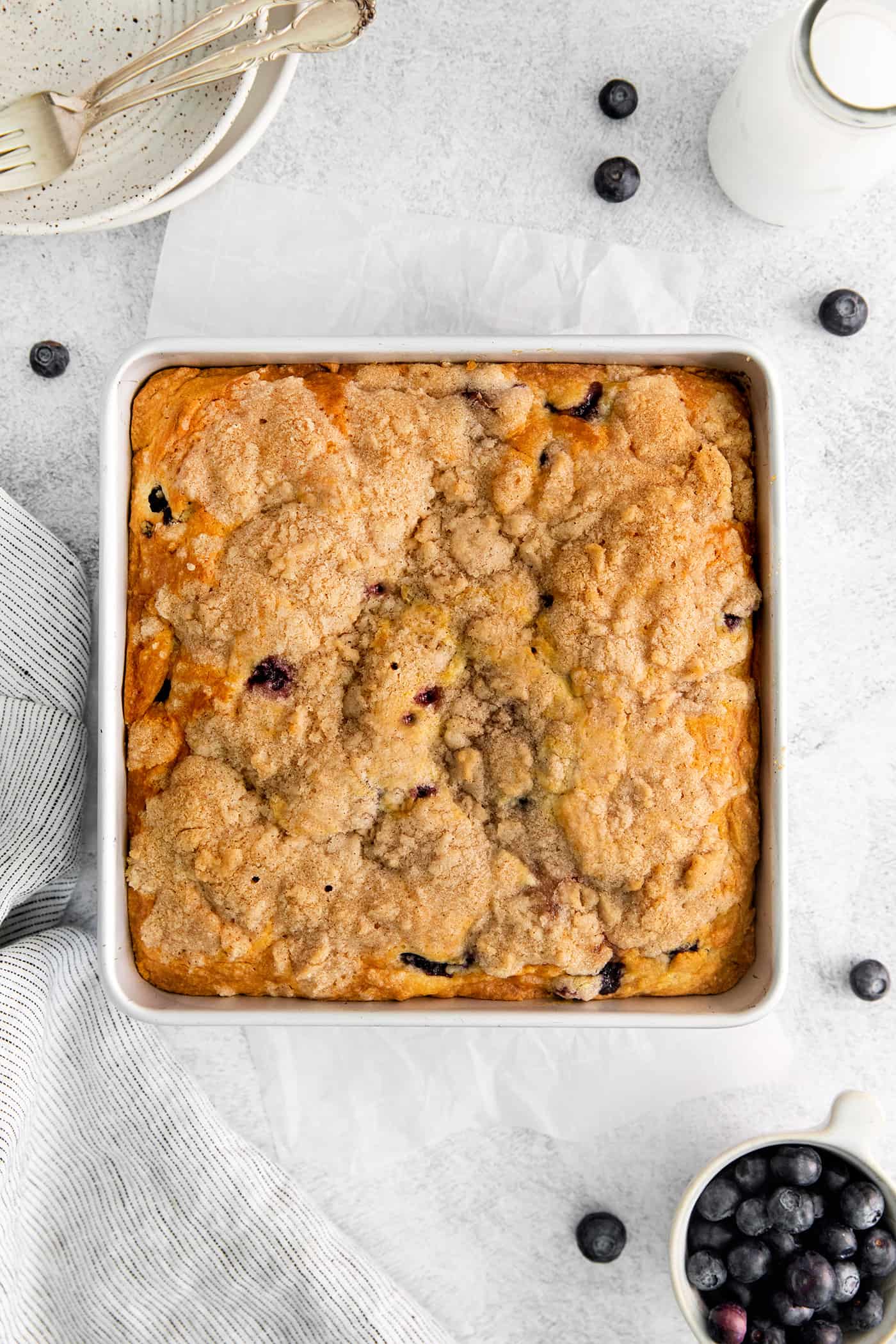 Overhead view of a pan of blueberry tea cake