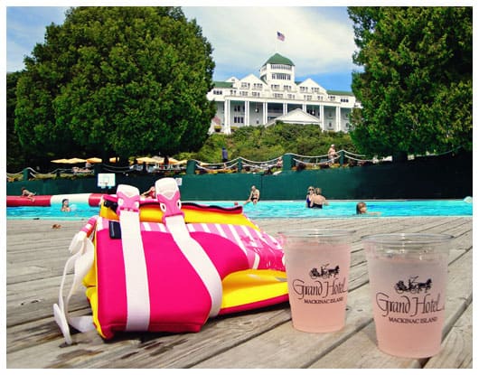 two drinks on the side of a pool