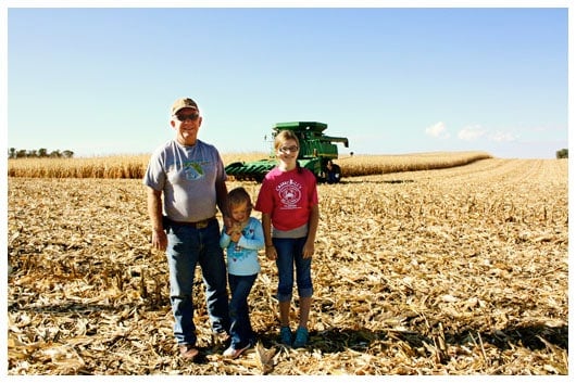 Two Girls and Their Grandpa in a Corn Field