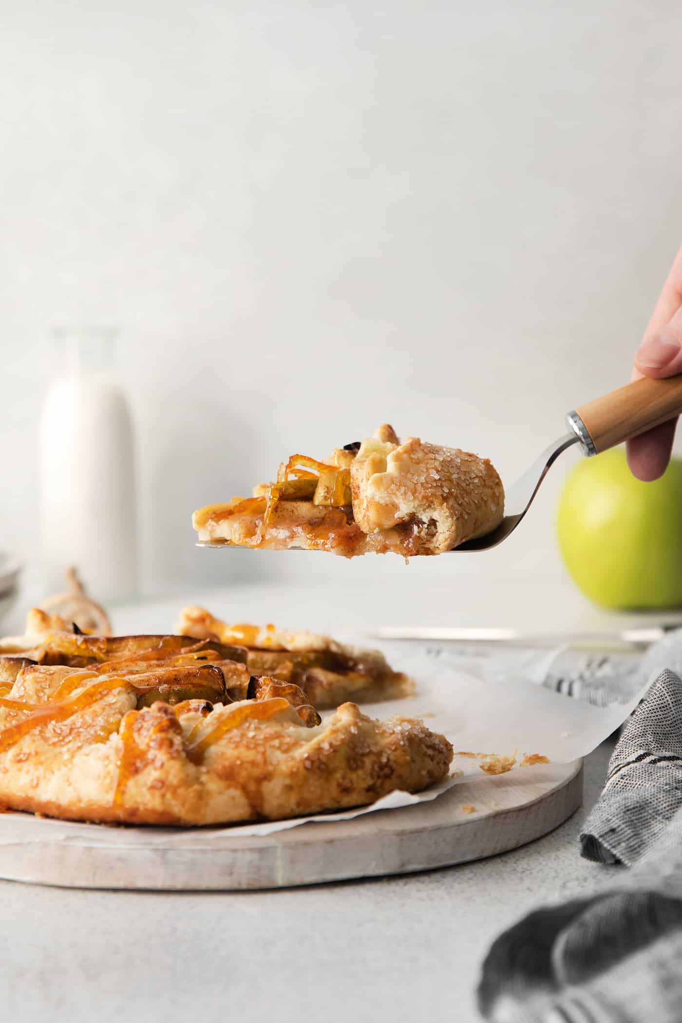 A slice of apple galette being served