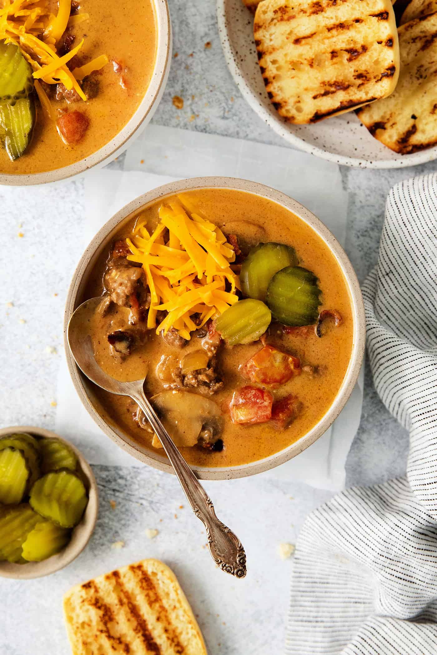 Overhead view of a bowl of bacon cheeseburger soup