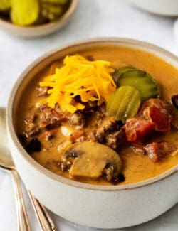 Angled view of a bowl of bacon mushroom cheeseburger soup