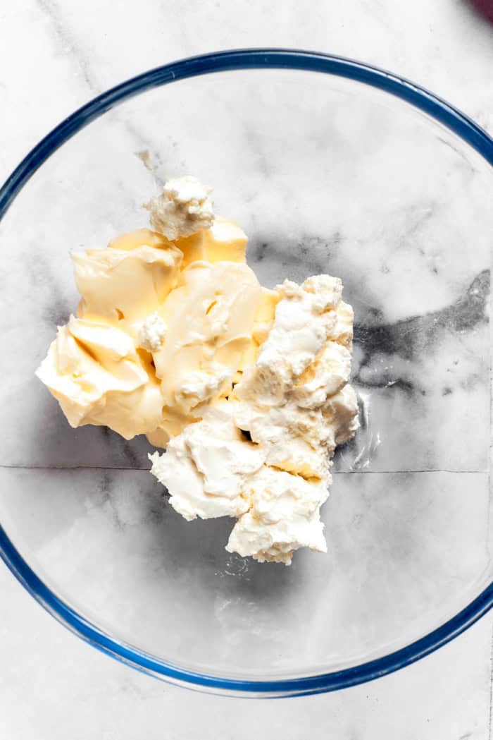 Butter and cream cheese in glass bowl