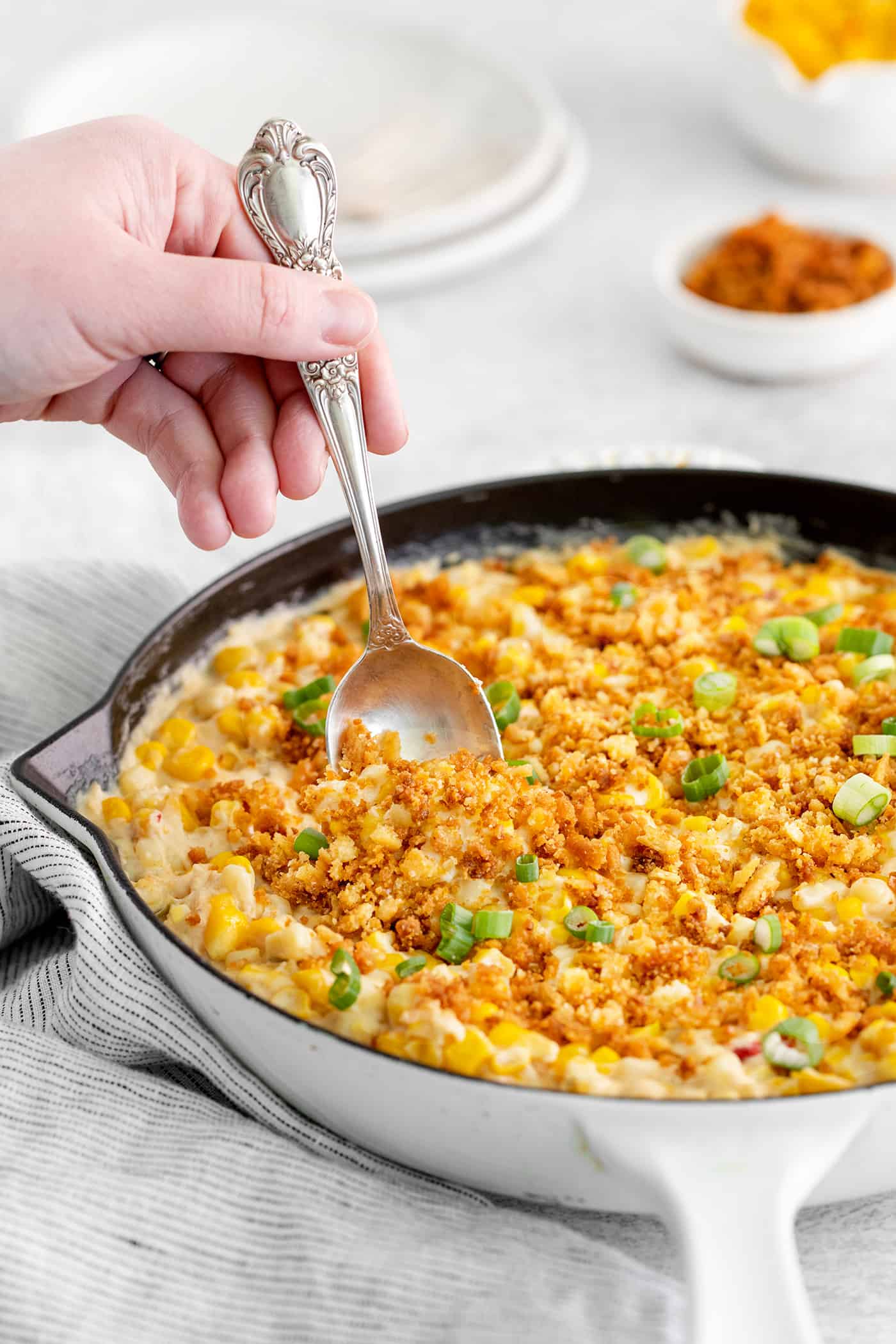 A spoon serving skillet corn