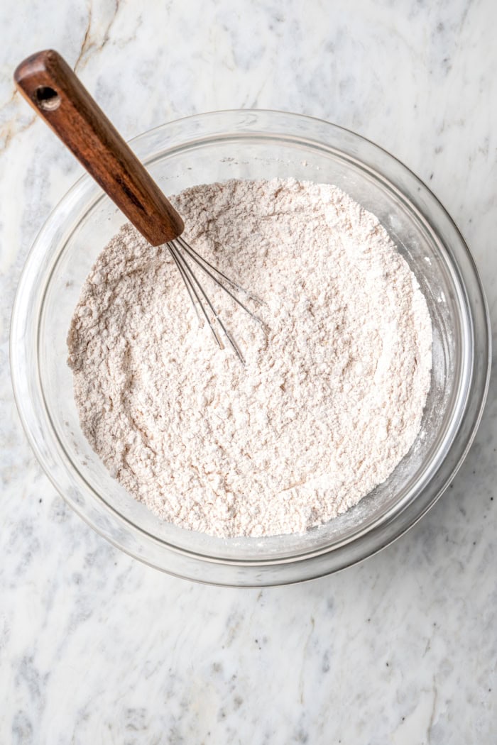 Whisking dry ingredients in mixing bowl
