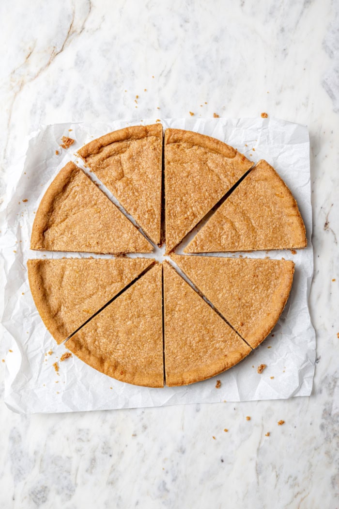 Overhead view of spices cookies cut into wedges
